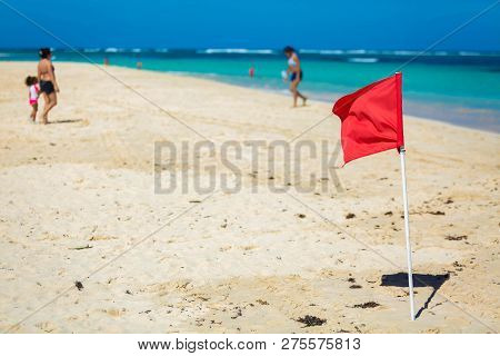 Red Flag Warning Sign At The Beack No Swimming