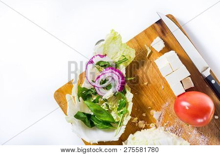 Vegetable Salad. Products and knife. Top view on a salad.