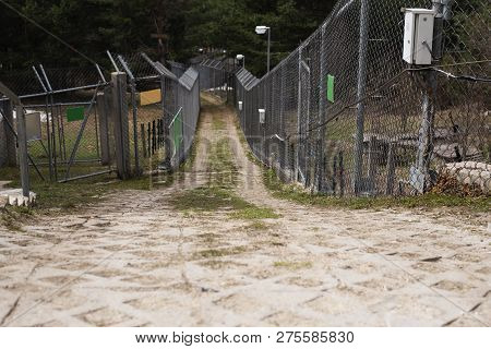 Metal Fence In Zoopark. Dancing Bears Park In Belitsa, Bulgaria