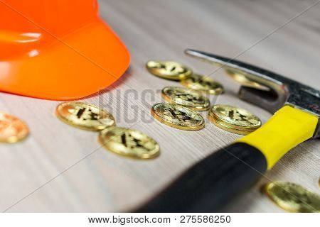 Cryptocurrency Bitcoin Mining With Mining Helmet And Pickaxe