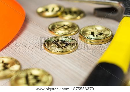 Cryptocurrency Bitcoin Mining With Mining Helmet And Pickaxe