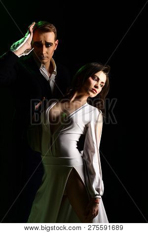 A Turbulent Romance. Couple In Love With Mime Makeup. Theatre Actors Miming Through Body Motions. Mi