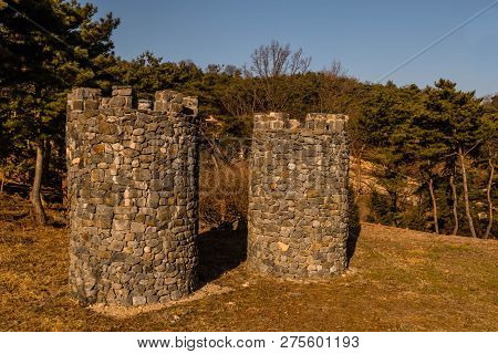 Two Stone Structures Resembling Castle Towers At Public Mountain Park On Sunny Day In Yesan, South K