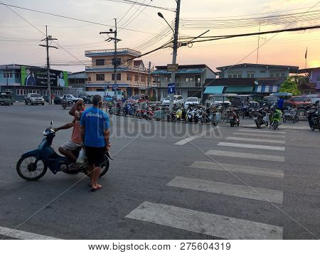 Photo Of Local Village In The Countryside Of Thailand With Street And Vehicles And Crossroad. Paknam