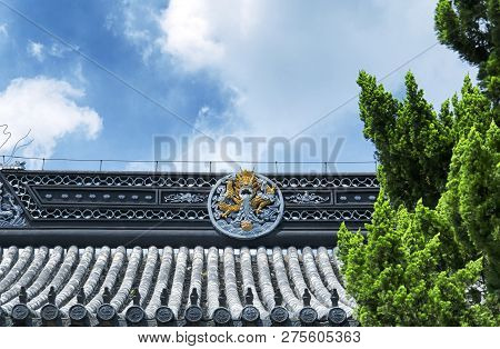 A Dragon Carving On The Roof Of Baosheng Temple In Luzhi Ancient Town In Wuzhong China.