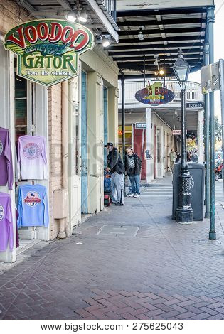 New Orleans, Usa - Dec 4, 2017: Walking On The Sidewalk Along Decatur Street Towards Wilkinson Stree