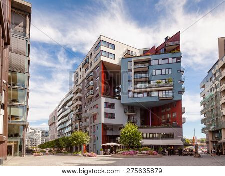 OSLO, NORWAY - JULY 23, 2018: Modern scandinavian architecture at renovated Tjuvholmen waterfront district, part of the Fjord City urban renewal project in Oslo