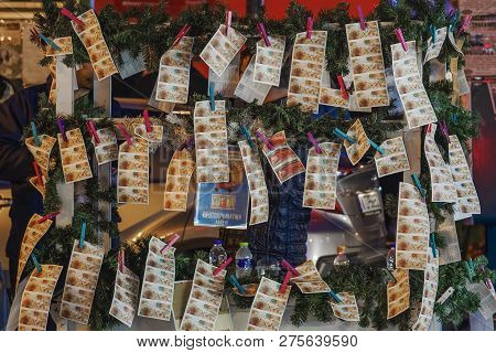 Thessaloniki, Greece - December 24 2018: Street Vendor Selling Greek Lottery Payslips. Evening Stree