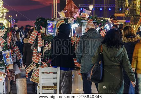Thessaloniki, Greece - December 24 2018: Street Vendor Selling Greek Lottery Payslips. Evening Stree