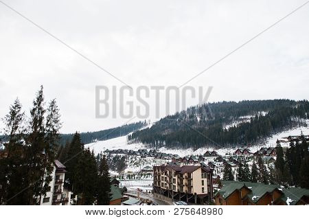Scenic Winter View Of Ski Resort With House And Cottage In Bukovel, Carpathian Mountains, Ukraine.