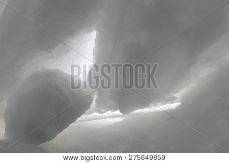 View From Inside The Ice Cave. Light Passes Through Snow Blocks
