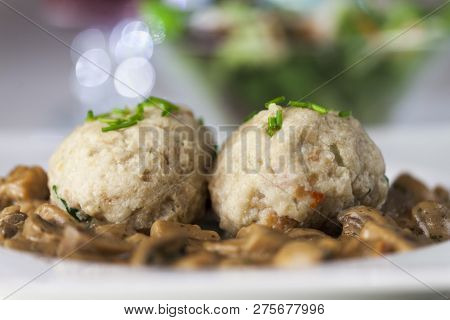 Closeup Of Bread Dumplings With Mushroom Sauce