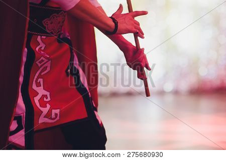 Man In National Costume Play National Music Instrument. Kurai.