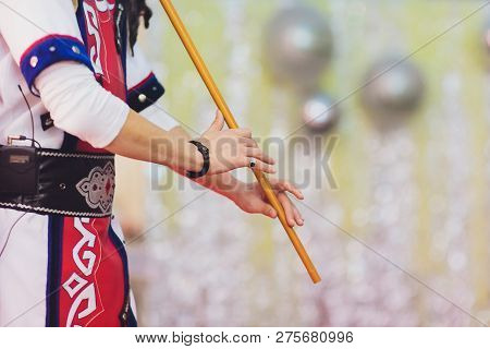 Man In National Costume Play National Music Instrument. Kurai.
