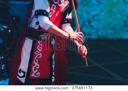 Man In National Costume Play National Music Instrument. Kurai.