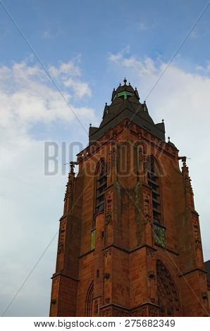 Medieval Red Brick Tower Of The Wetzlar Cathedral Against The Blue Sky. Historic Part Of Wetzlar Cit
