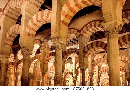 Cordoba, Spain - Nov 18: Striped Arch And Columns Under Dome Of The Moorish Mezquita, Mosque-cathedr
