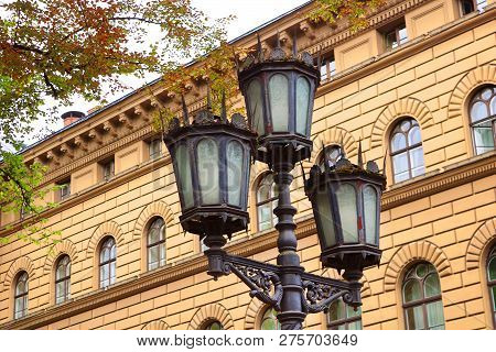 Lantern Near Main Building Of The Saeima - Parliament Of The Republic Of Latvia In Riga Old City At 