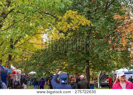 Arrowtown, New Zealand - April 2018: Tourists Flock To Arrowtown For The Akura Arrowtown Autumn Fest