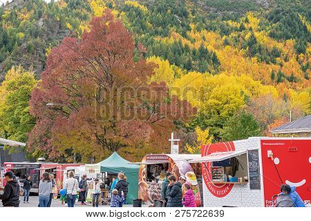 Arrowtown, New Zealand - April 2018: Tourists Flock To Arrowtown For The Akura Arrowtown Autumn Fest