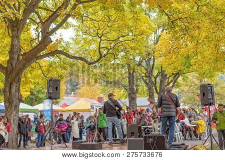 Arrowtown, New Zealand - April 2018: Tourists Flock To Arrowtown For The Akura Arrowtown Autumn Fest