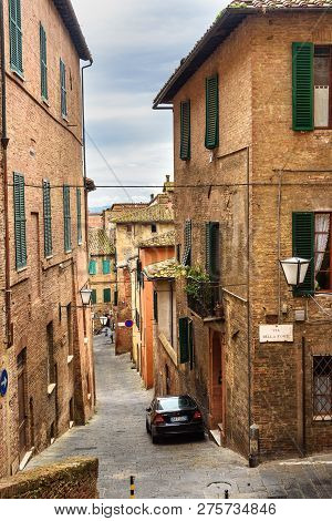 Siena, Italy - October 02, 2018: Medieval Narrow Street Vicolo Fonte In Old City Siena