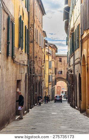 Siena, Italy - October 02, 2018: Medieval Narrow Street Via Giovanni Dupre In Old City Siena