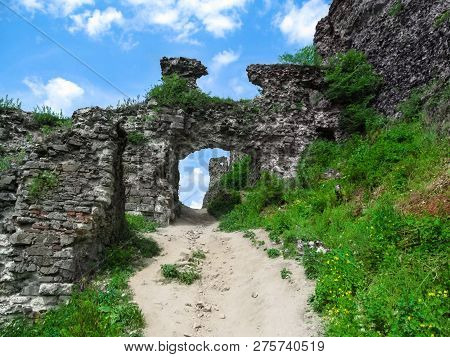The Remains Of The Ancient Gates To The Medieval Khust Castle. The Passage Between The Gray Stone Ru
