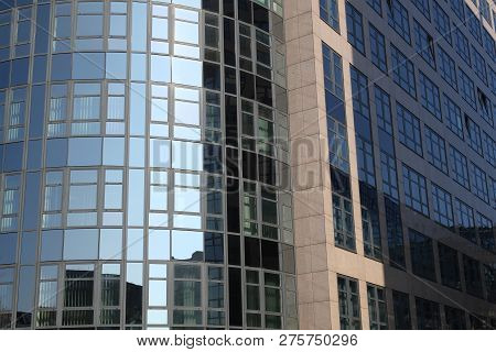 Office House With A Reflecting Facade From Glass