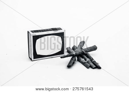 Close Up Of Mini Cigar Or Mini Cigarette Or Bidi Or Beedi Isolated On White With A Matchbox.