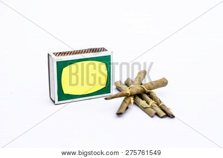 Close Up Of Mini Cigar Or Mini Cigarette Or Bidi Or Beedi Isolated On White With A Matchbox.
