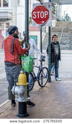 New Orleans, Usa - Dec 4, 2017: A Few Men Congregates Around A 