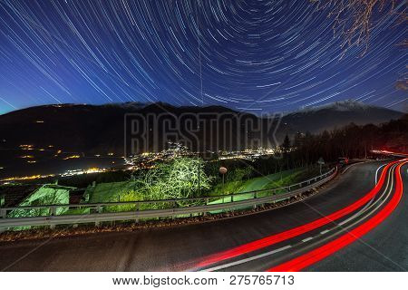 The Car And Star Tails On The Sky Motta, Italy.