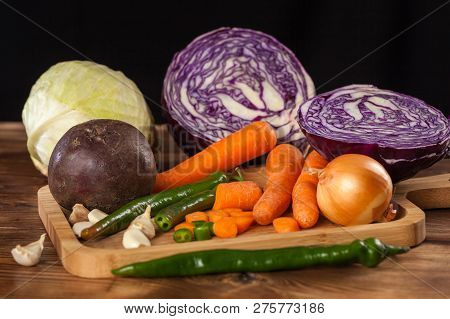Verious Fresh Vegetables On A Wooden Table, Healthy Food