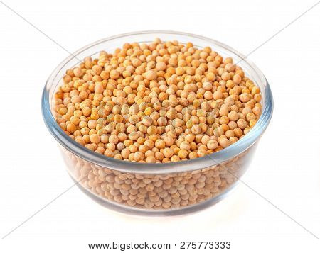 Seeds Of Peas On Glass Bowl On White Background
