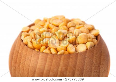 Dry Yellow Peas On Wooden Bowl Isolated On White Background