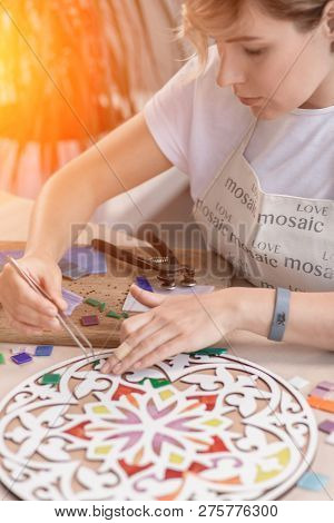 Workplace Of The Mosaic Master: Womens Hands Holding Tool For Mosaic Details In The Process Of Makin