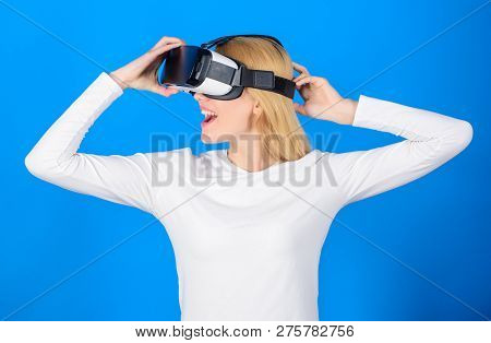 Woman Using Virtual Reality Headset. Portrait Of Young Woman Wearing Vr Goggles, Experiencing Virtua