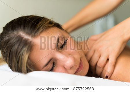 Young woman having a massage in a spa