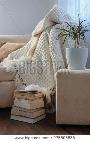 Stylish Brightly Interior Of Living Room. Inviting Comfortable Sofa With Handmade Woolen Blanket, Bo