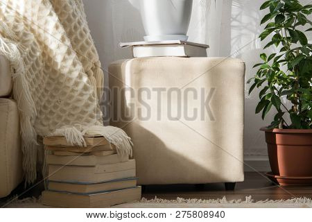 Stylish Brightly Interior Of Living Room. Inviting Comfortable Sofa With Handmade Woolen Blanket And