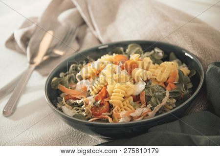 Salad made from radiatori cooked pasta, goat cheese and oil vinaigrette