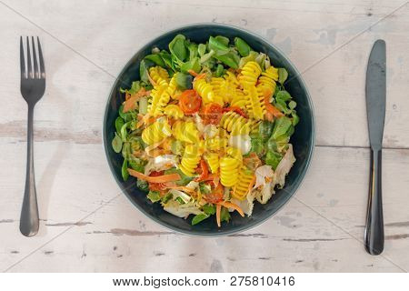 Salad made from radiatori cooked pasta, goat cheese and oil vinaigrette