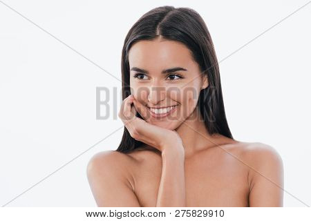 Portrait Of Cute Young Smling Woman Touches Her Clean Skin, On White Background.