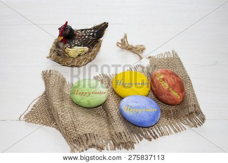 Easter Multicolored Eggs On A White Wooden Background. Chicken And Easter Eggs. Easter Background. E