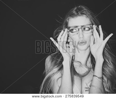 Woman Attractive With Big Breasts Wears Ugly Eyeglasses For Vision. Sexy Girl With Makeup And Big Ea