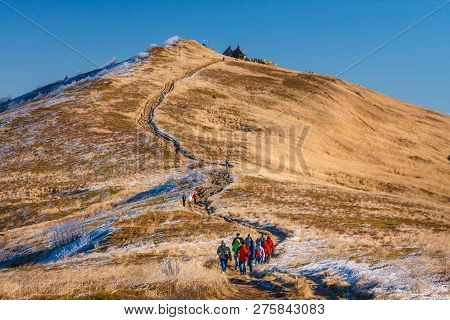 Wetlina, Poland, November 12, 2011: A Group Of Tourists Hiking On A Trail In Polonina Wetlinska On A