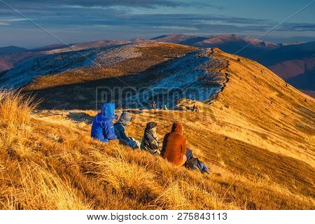Wetlina, Poland, November 12, 2011:group Of People Enjoy The Sunset Over Bieszczady Mountains, South