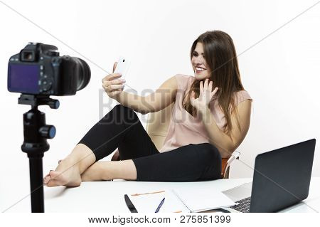 Blogger Concepts. Cheerful Caucasian Female Vlogger Making Selfie On Cellphone For Blog. Isolated Ag