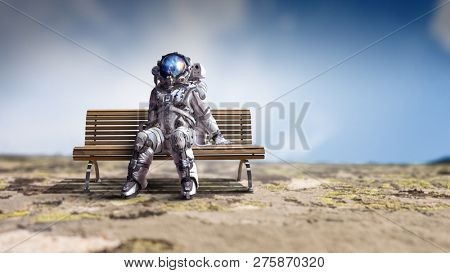 Rocketman on bench. Mixed media